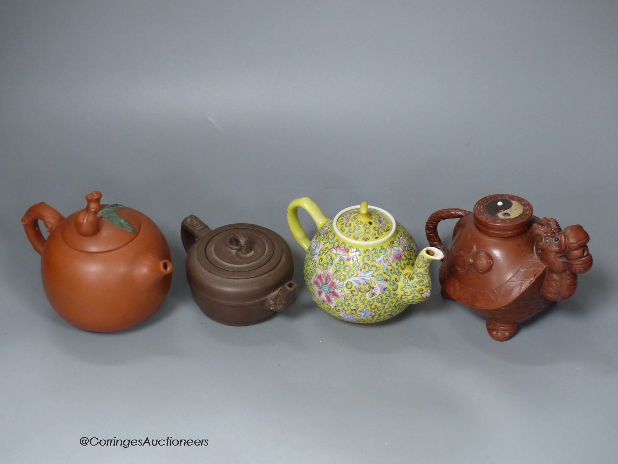 Three Chinese Yixing teapots and a yellow ground teapot, height 10cm